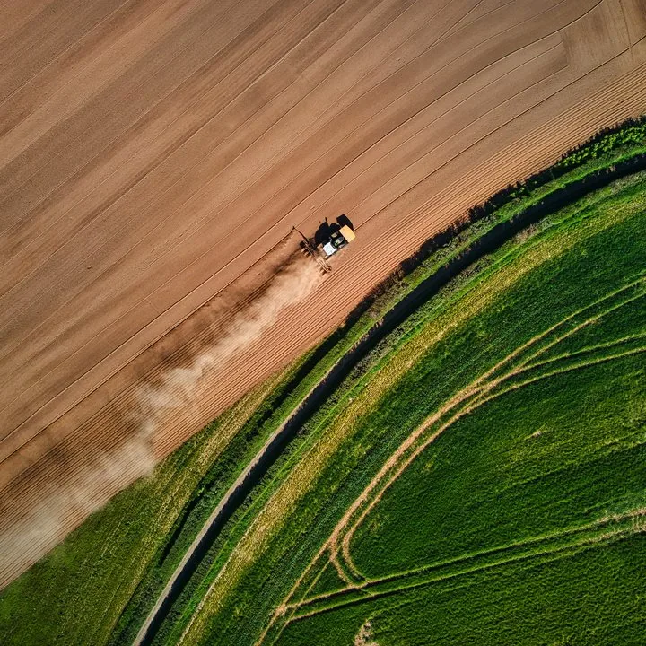 Aerial view of a harvester in a field